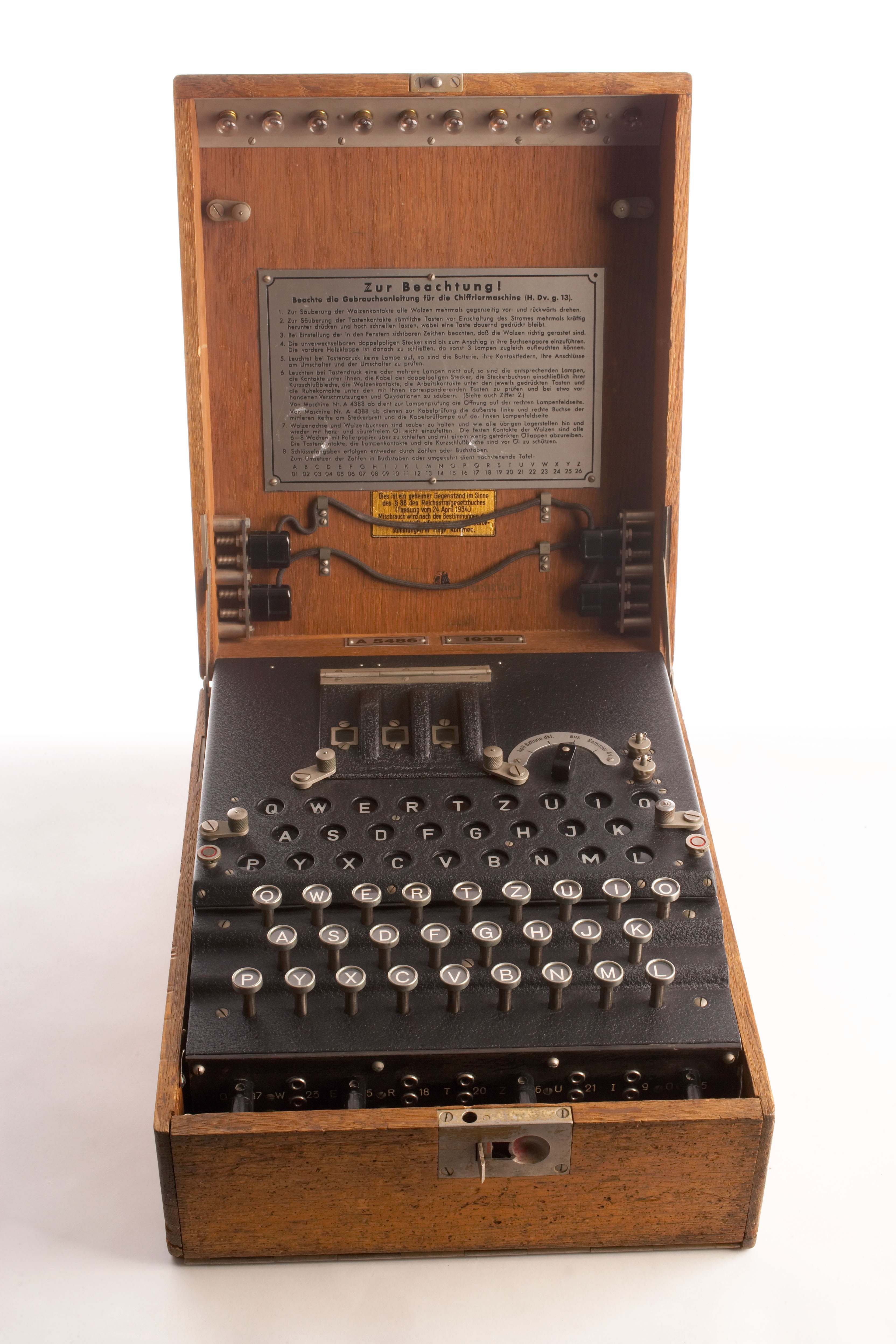 An Enigma cipher machine in its wooden case, from the CIA museum collection